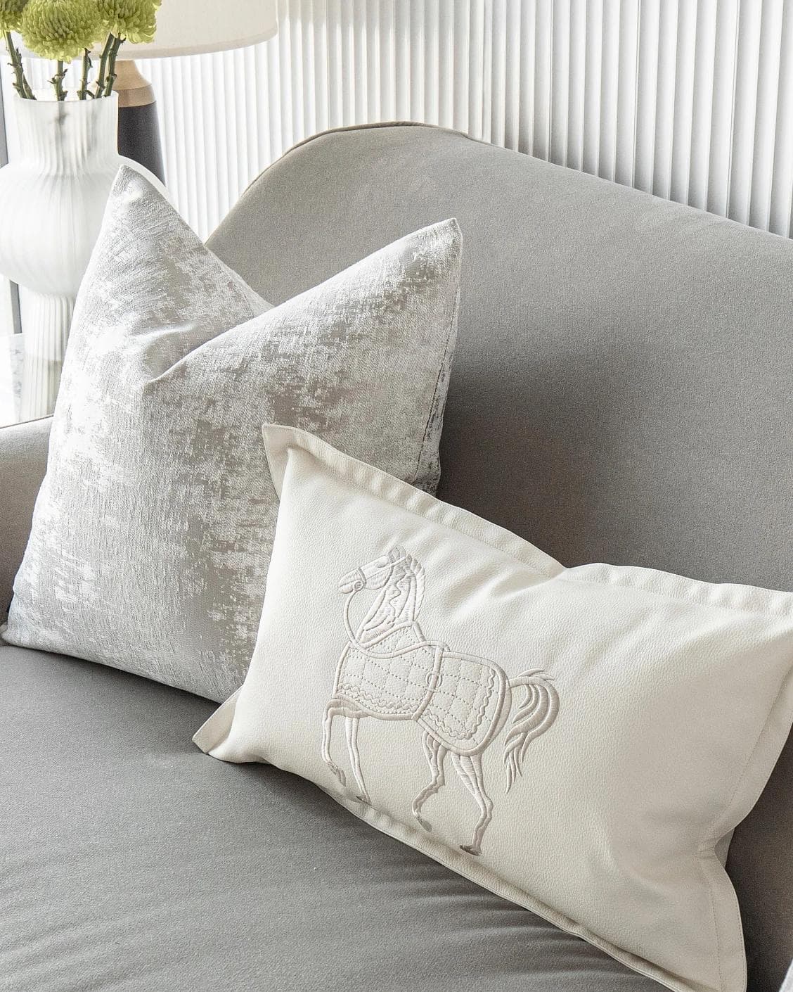 Klaus Bundle cushion in silver, grey and white, shown in a lifestyle right view as image 5