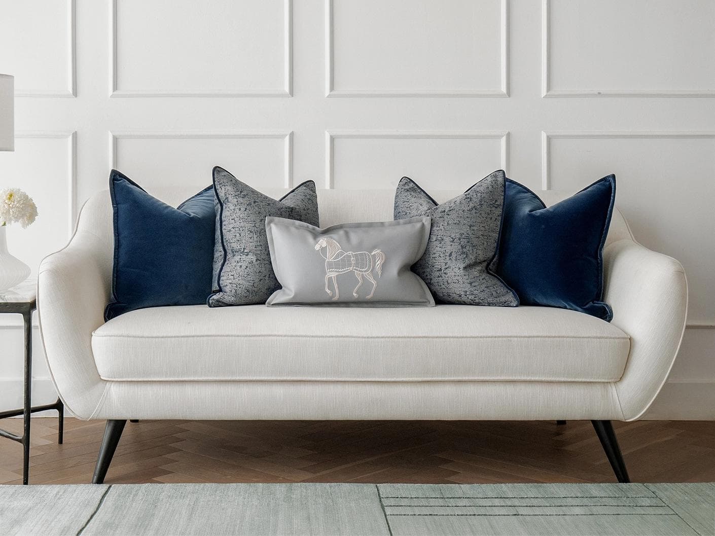 John Bundle cushion in blue, silver and white, shown in a lifestyle front view as image 4