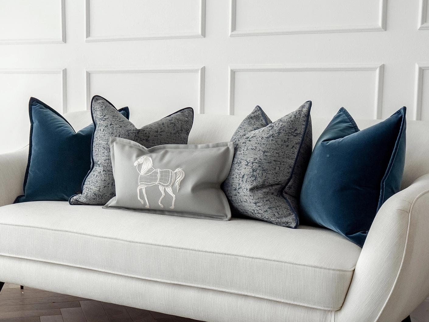 John Bundle cushion in blue, silver and white, shown in a lifestyle right view as image 2