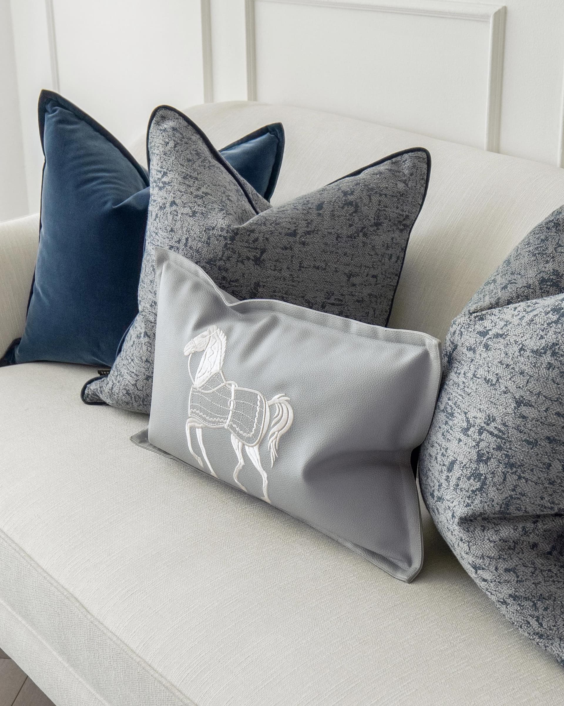 John Bundle cushion in blue, silver and white, shown in a product right view as image 5