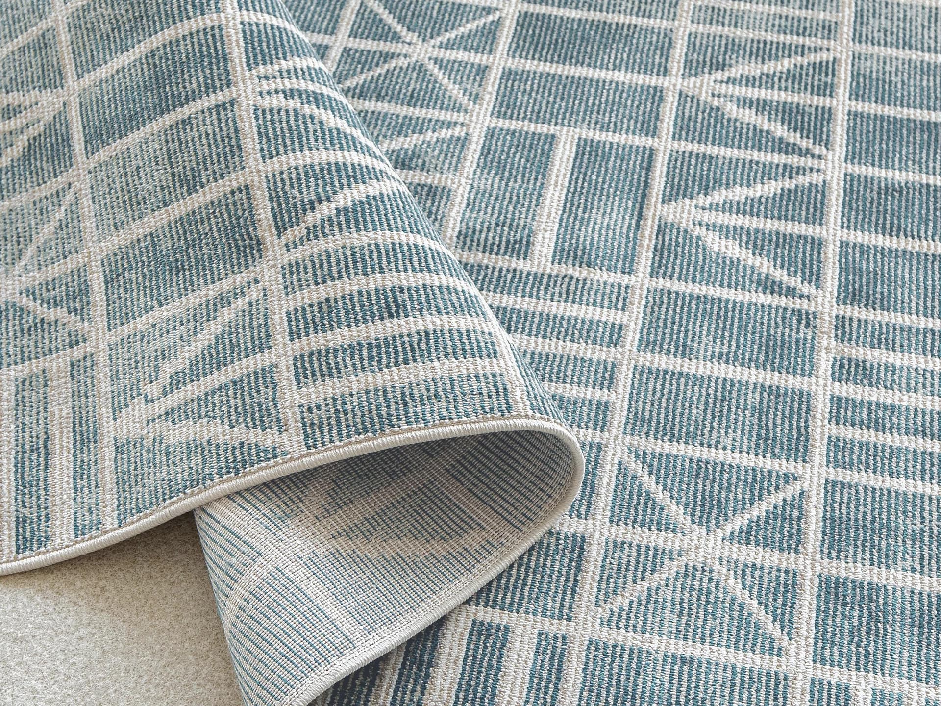 Hunter Sky carpet in sky and turquoise, shown in a lifestyle top view as image 6