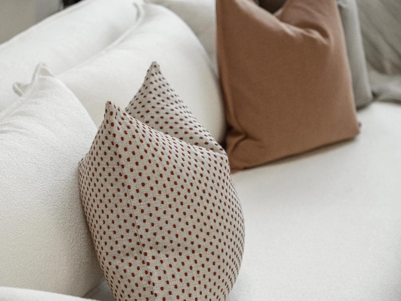 Abhishek Bundle cushion in brown and rust, shown in a product left view as image 7