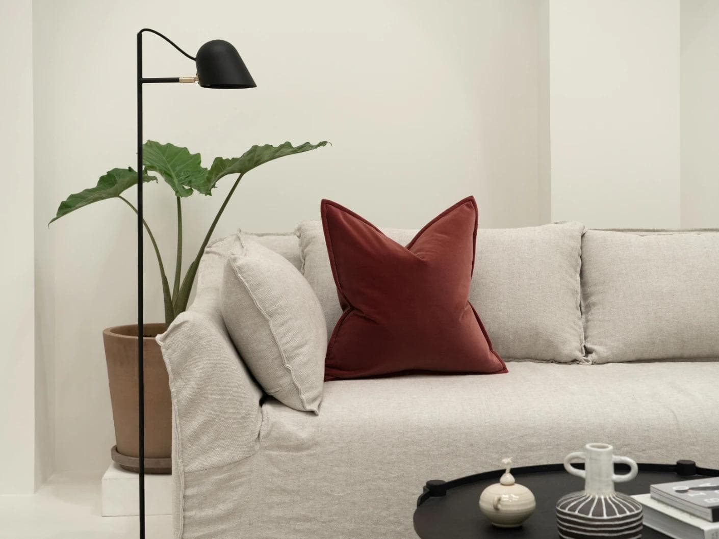 Alessandra Cherry cushion in red, shown in a lifestyle front view as image 4