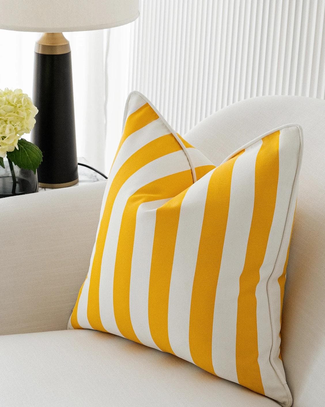 Aelia Gaze cushion in yellow, shown in a lifestyle right view as image 5