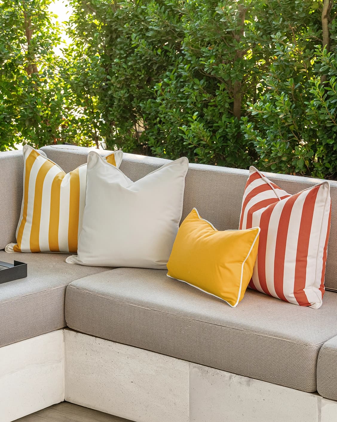 Aarush Bundle cushion in orange, yellow and ivory, shown in a lifestyle right view as image 2