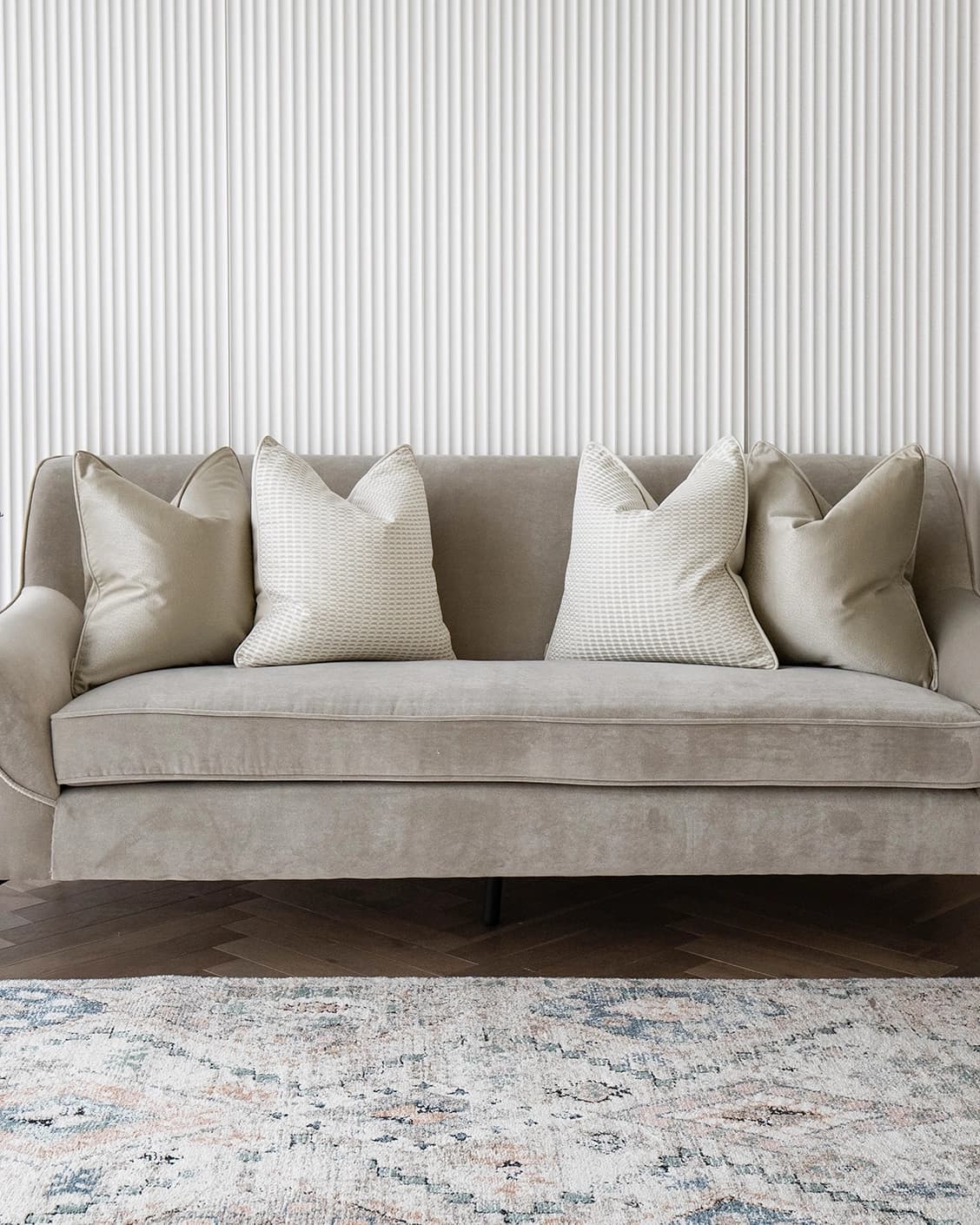 Adeline Bundle cushion in gold, beige and white, shown in a lifestyle front view as image 2