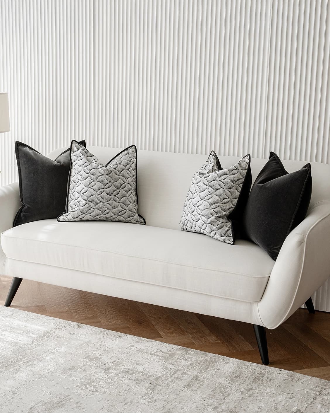 Adham Bundle cushion in black, grey and white, shown in a lifestyle right view as image 2