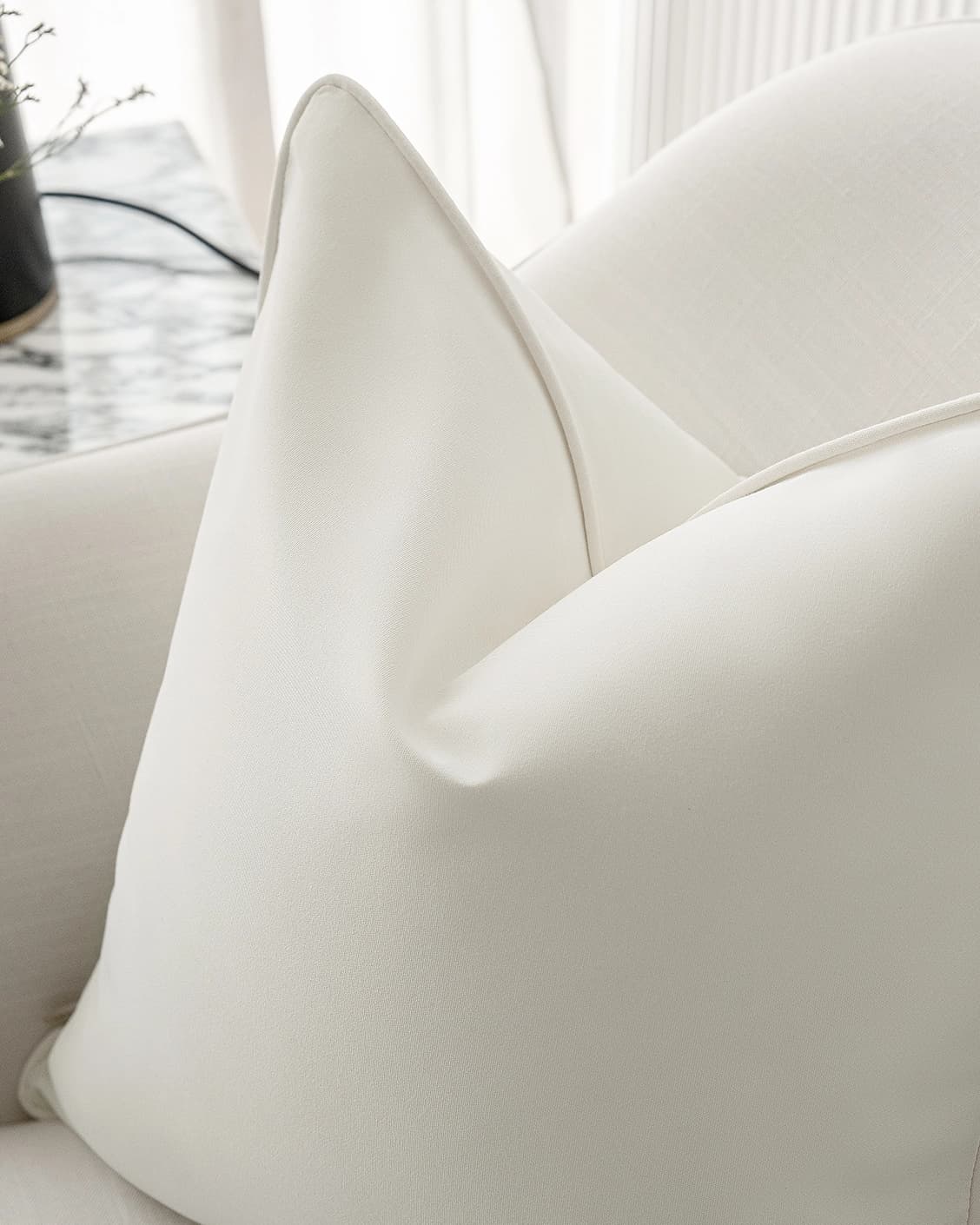 aelia-bianca-ivory-outdoor-lifestyle-right-view-cushion-id-DSC09534.webp