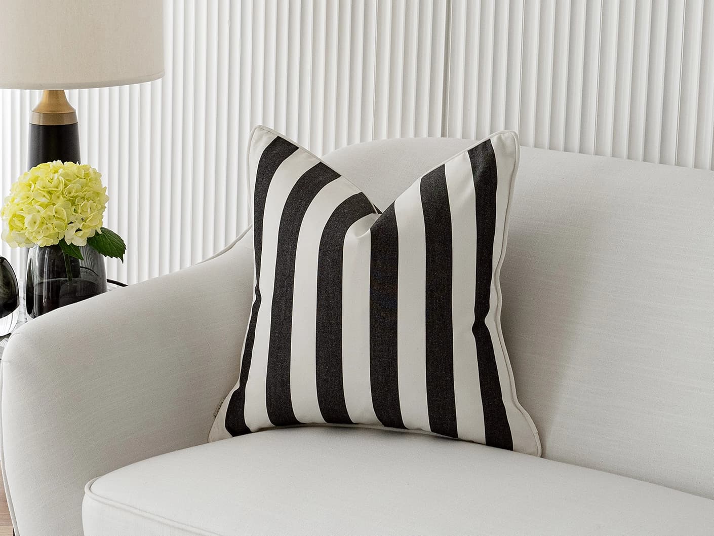 Aelia Ebony single cushions in ebony and black, shown in a lifestyle front view