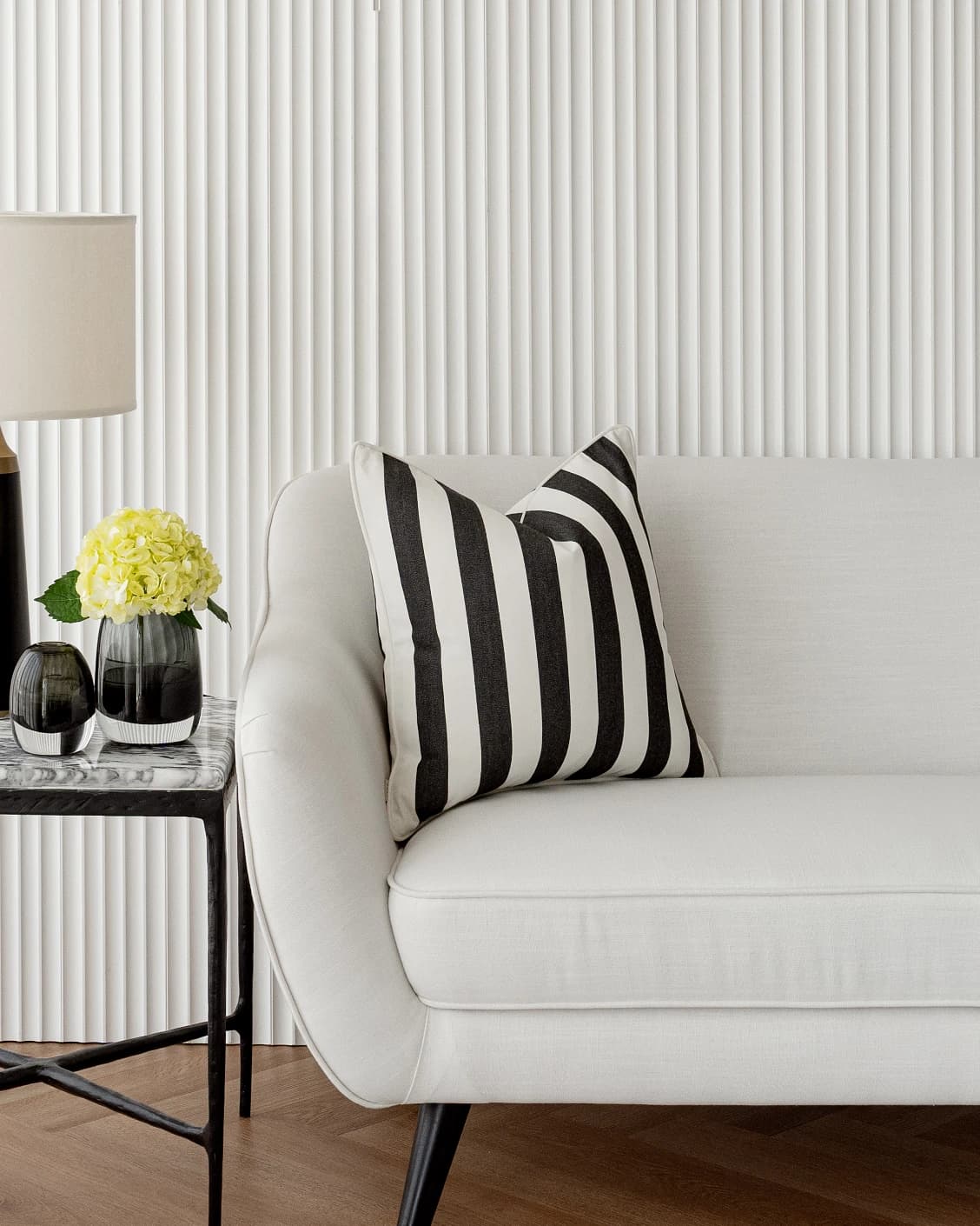 Aelia Ebony cushions in ebony and black, shown in a lifestyle left view as video image