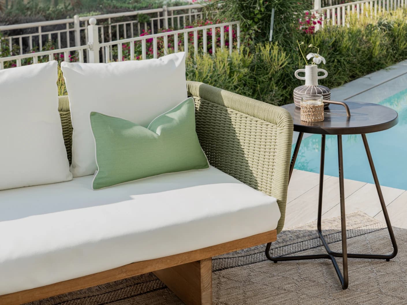Aelia Fern II single cushions in fern, forest green and green, shown in a lifestyle left view