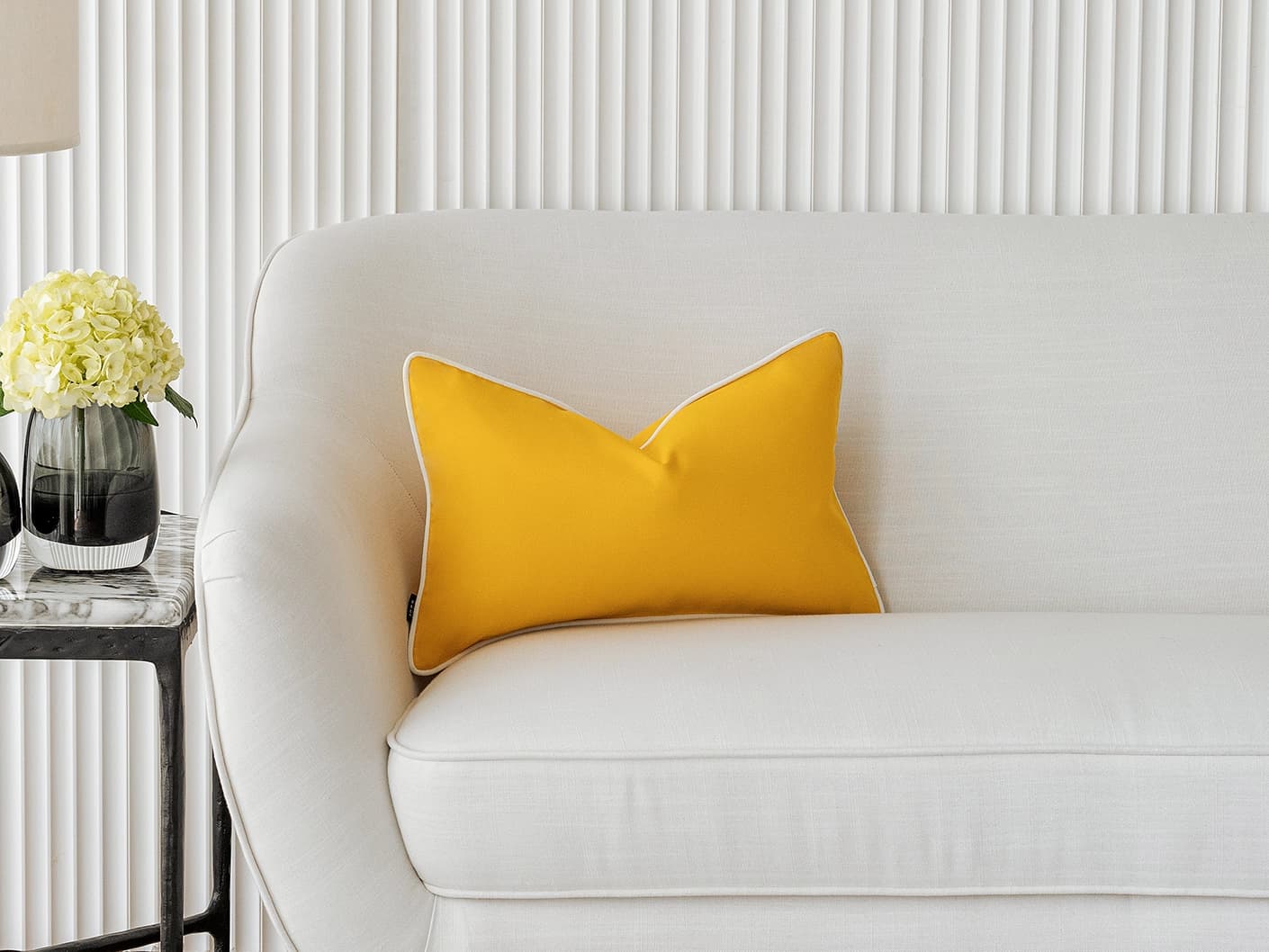 Aelia Klimt II single cushions in yellow and ivory, shown in a lifestyle front view