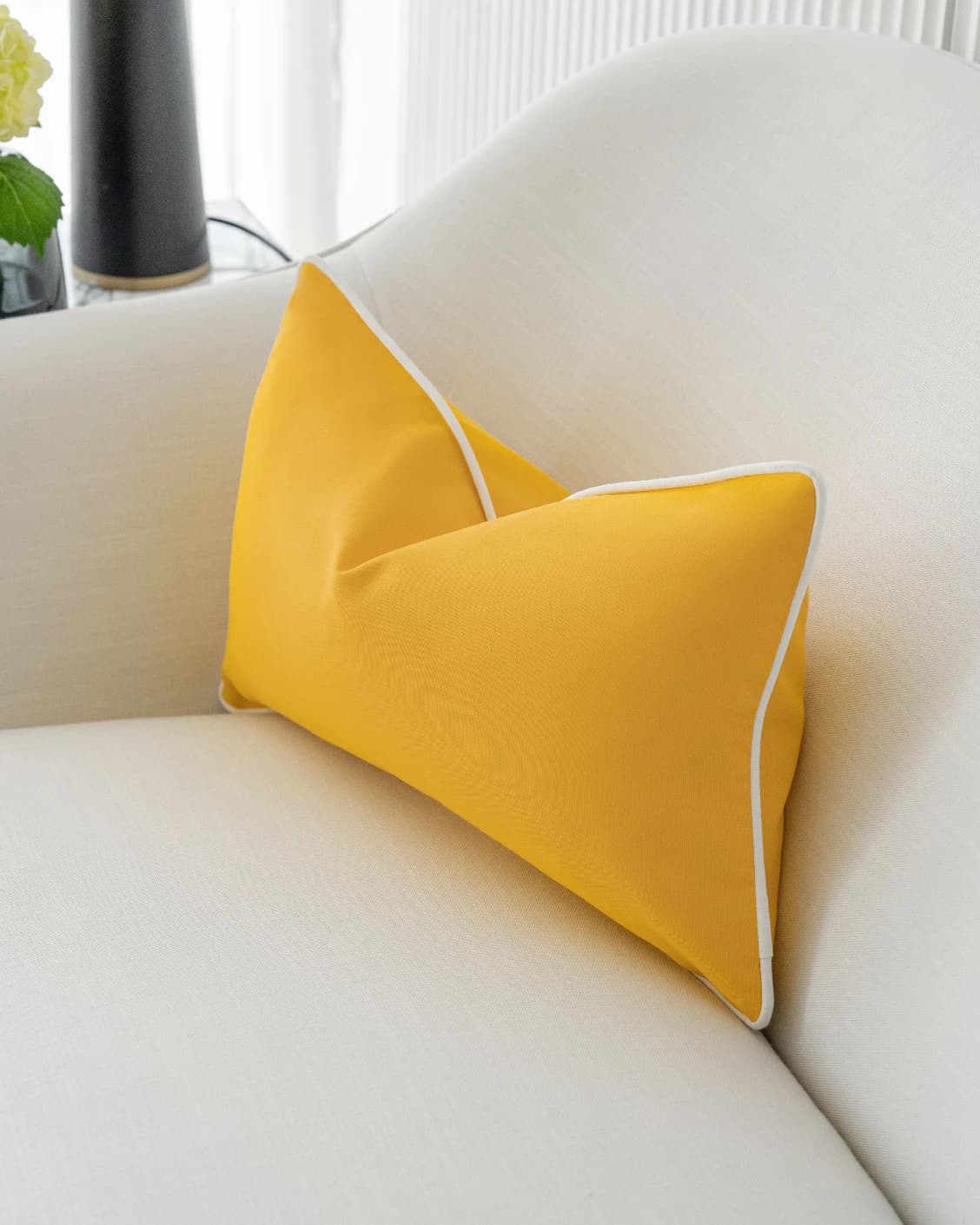Aelia Klimt II cushions in yellow and ivory, shown in a lifestyle right view as video image