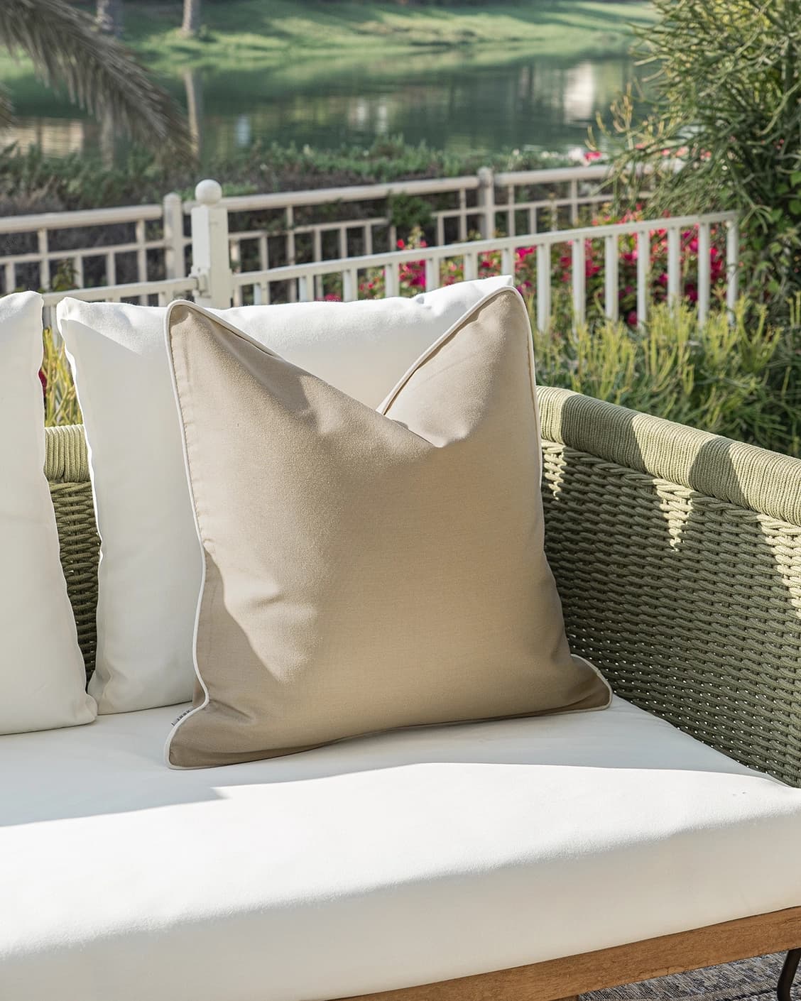 Aelia Mocha cushion in beige, shown in a lifestyle left view as image 2