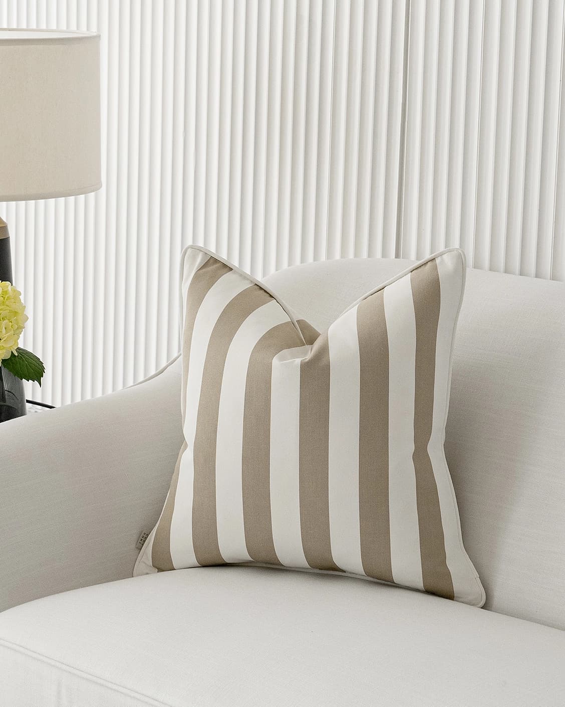 Aelia Sandy cushion in sandy and beige, shown in a lifestyle front view as image 4