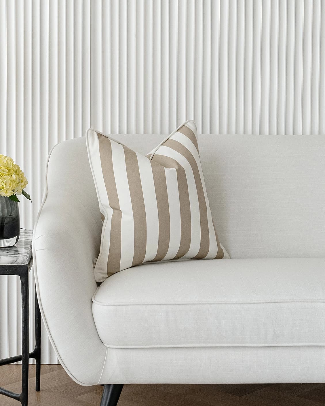 Aelia Sandy cushions in sandy and beige, shown in a lifestyle right view as video image