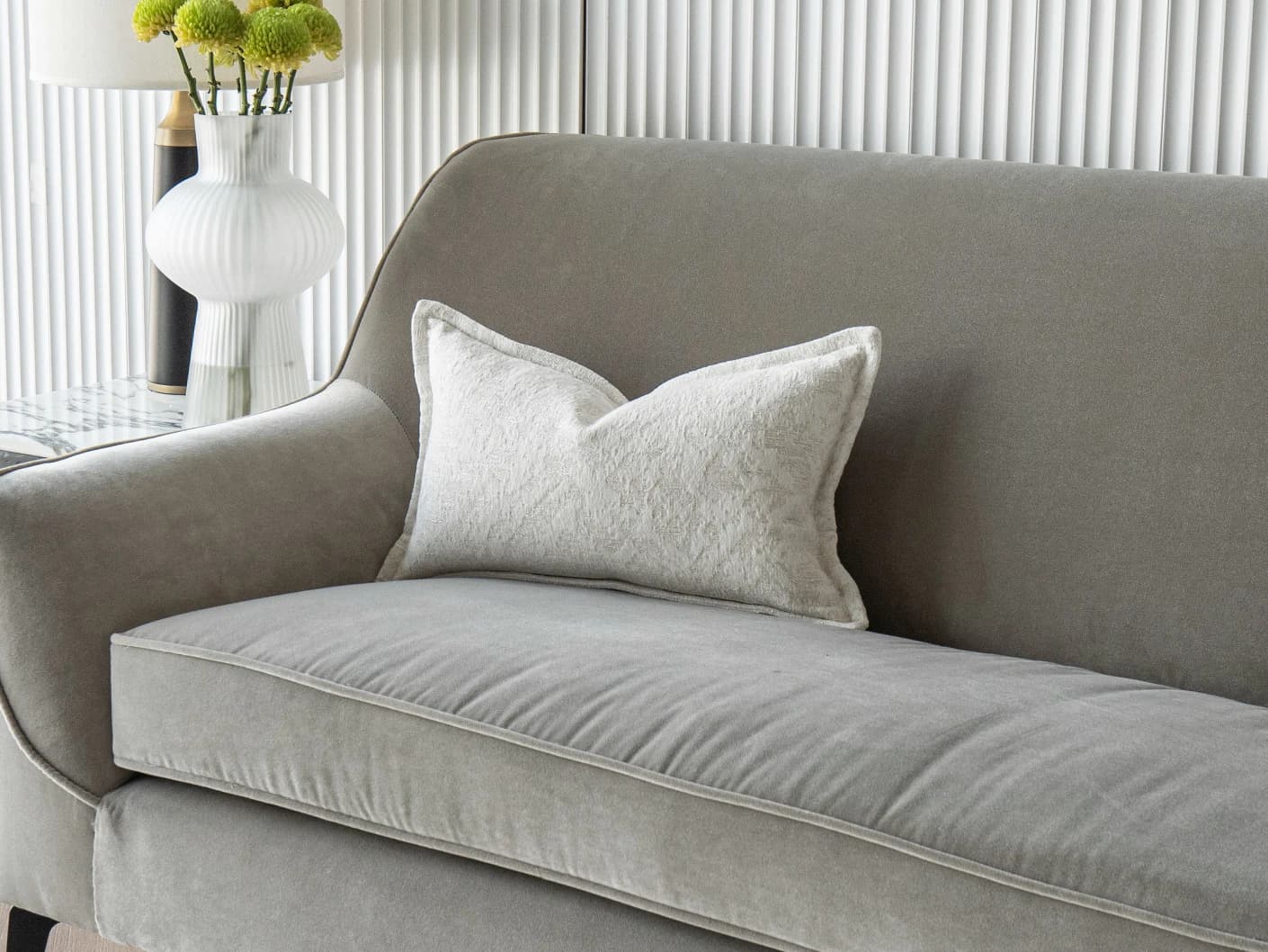 Aidan Bianca single cushions in white, shown in a lifestyle front view