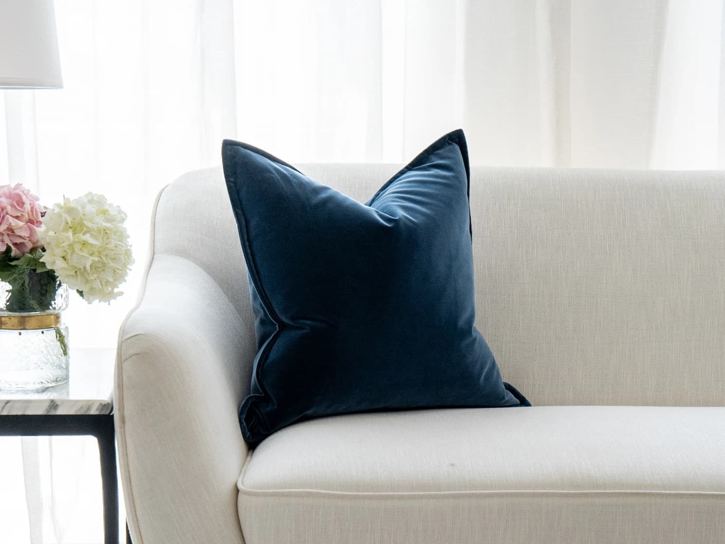 Alessandra Canova single cushions in royal blue and blue, shown in a lifestyle front view
