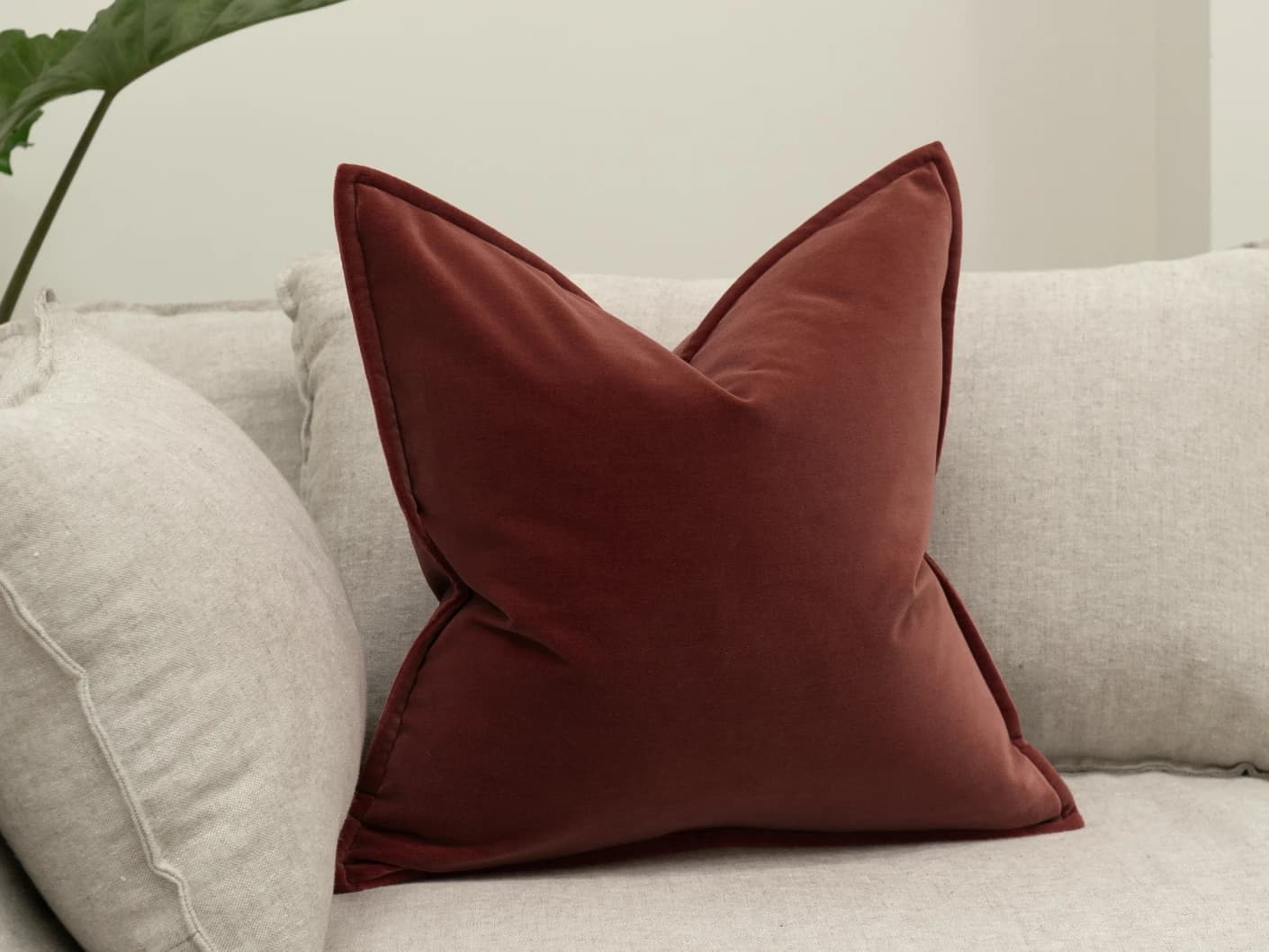 Alessandra Cherry single cushions in red, shown in a lifestyle front view