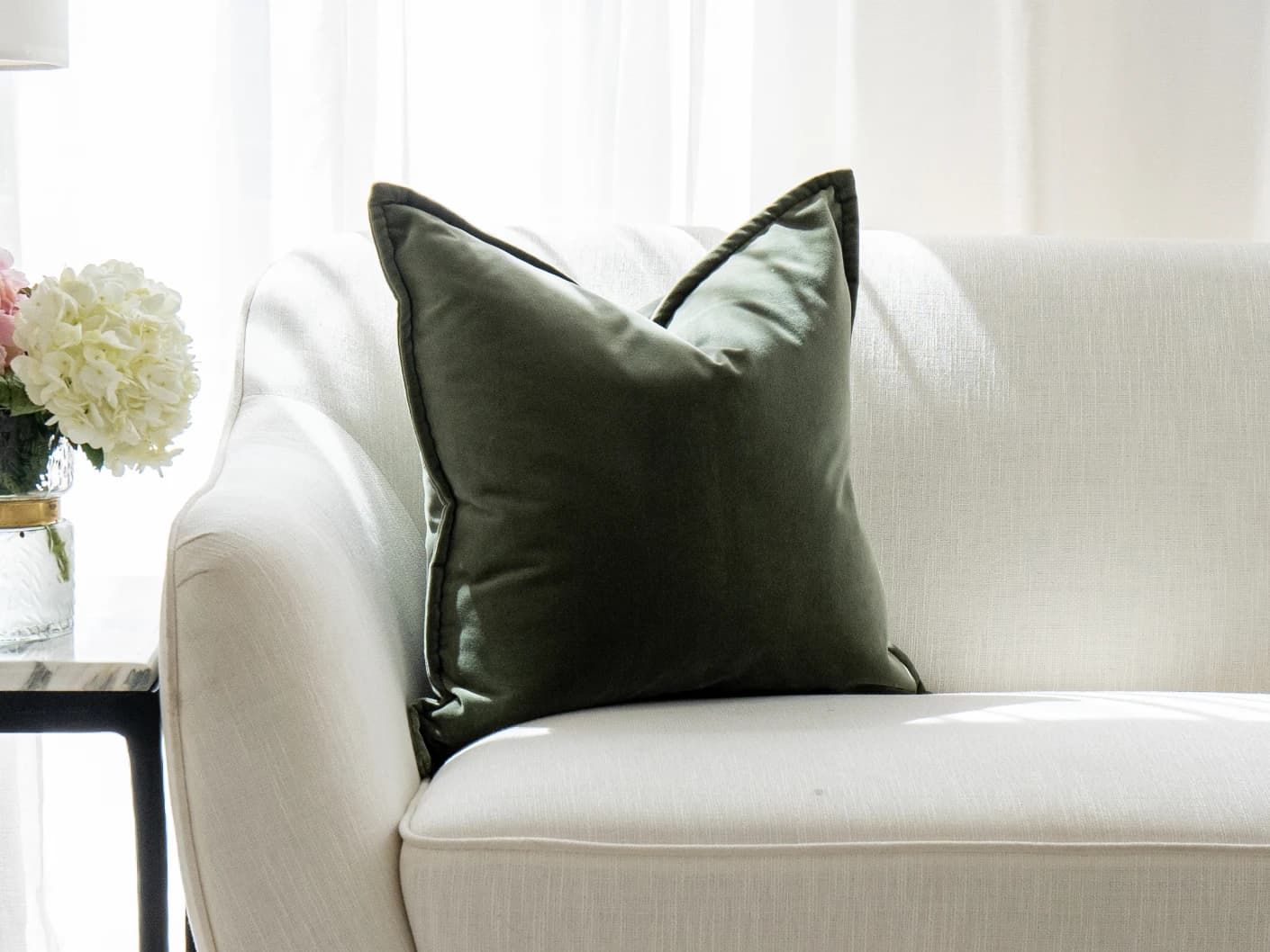 Alessandra Forest single cushions in green and forest green, shown in a lifestyle front view