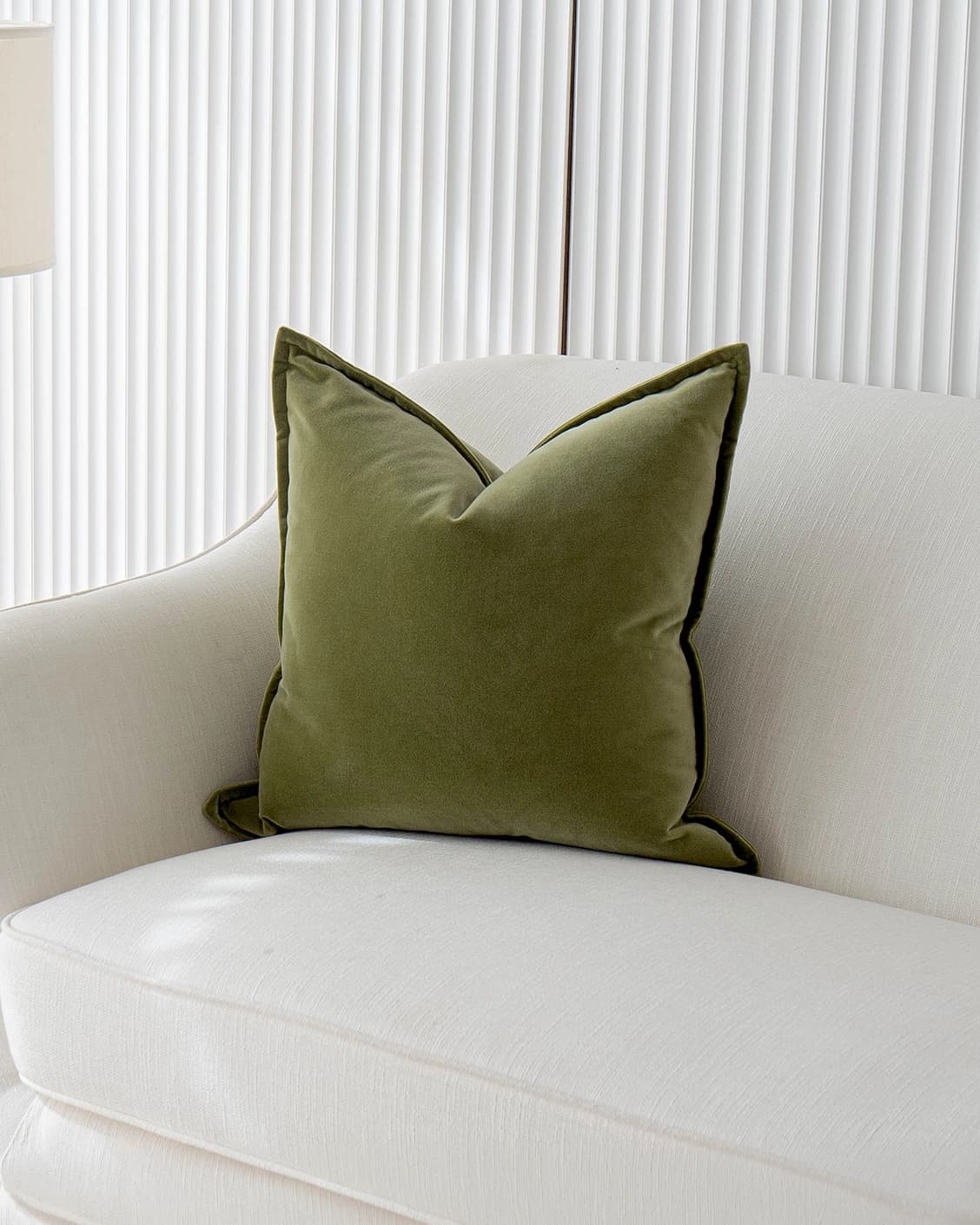 Alessandra Jade cushion in green, shown in a lifestyle front view as image 2