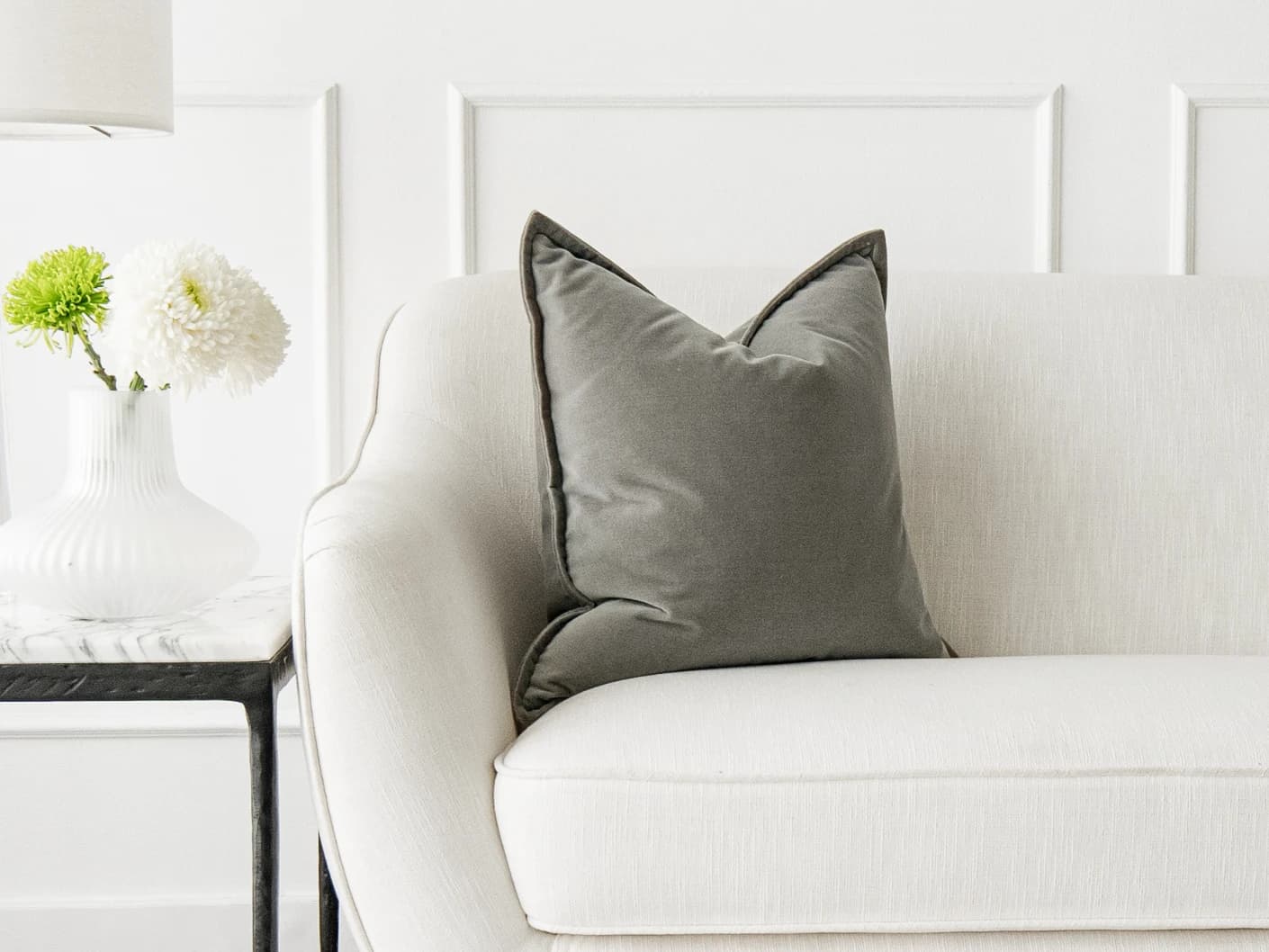 Alessandra Laurent single cushions in grey, shown in a lifestyle front view