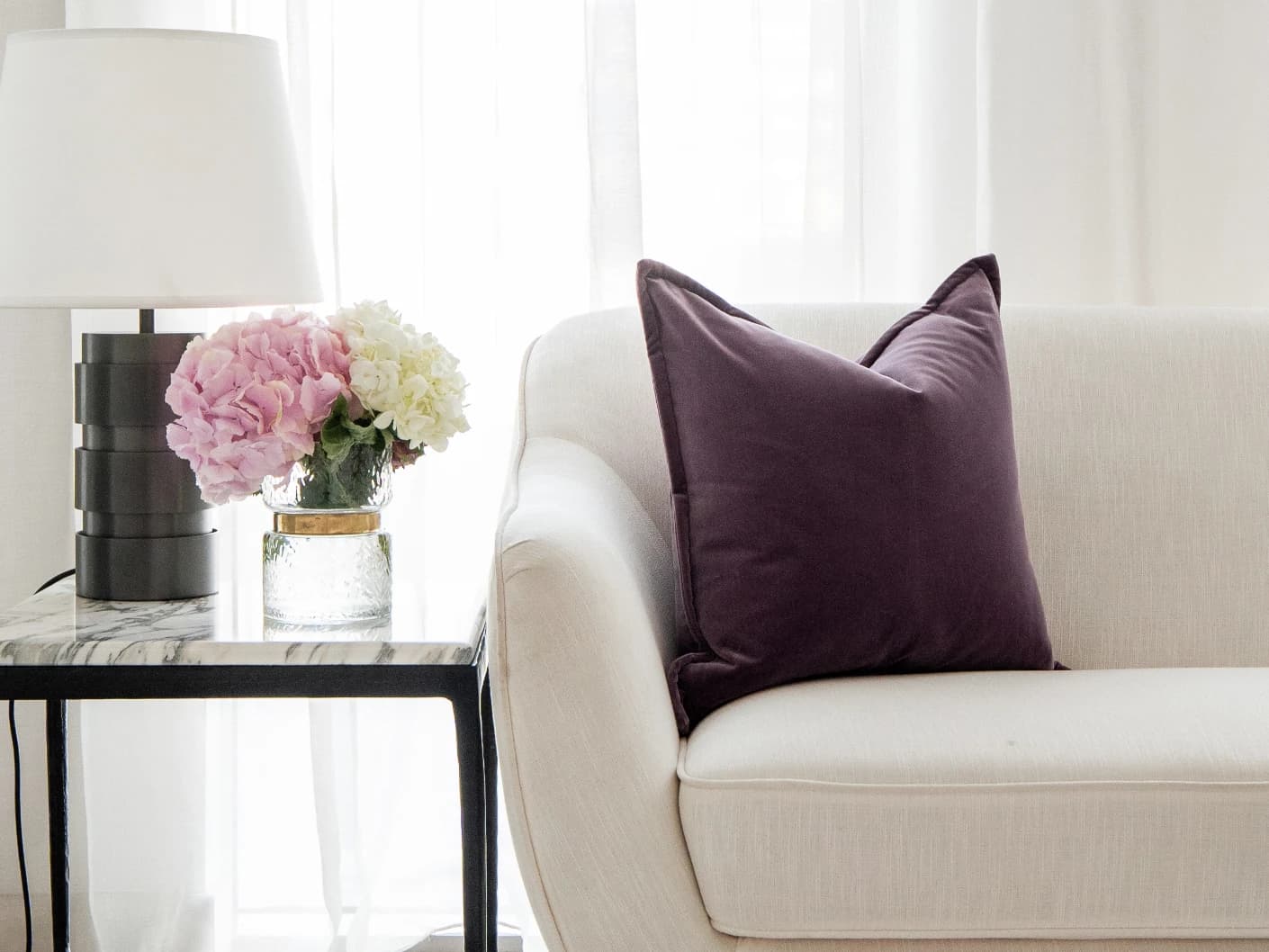 Alessandra Mauveine single cushions in purple, shown in a lifestyle front view