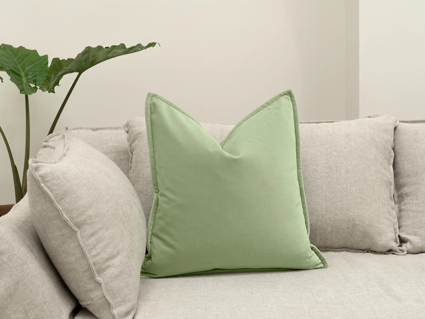 Alessandra Pistachio single cushions in pistachio and green, shown in a lifestyle front view
