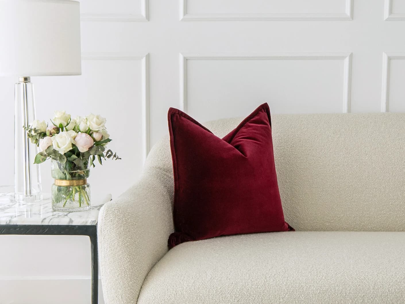 Alessandra Scarlet single cushions in red, shown in a lifestyle front view