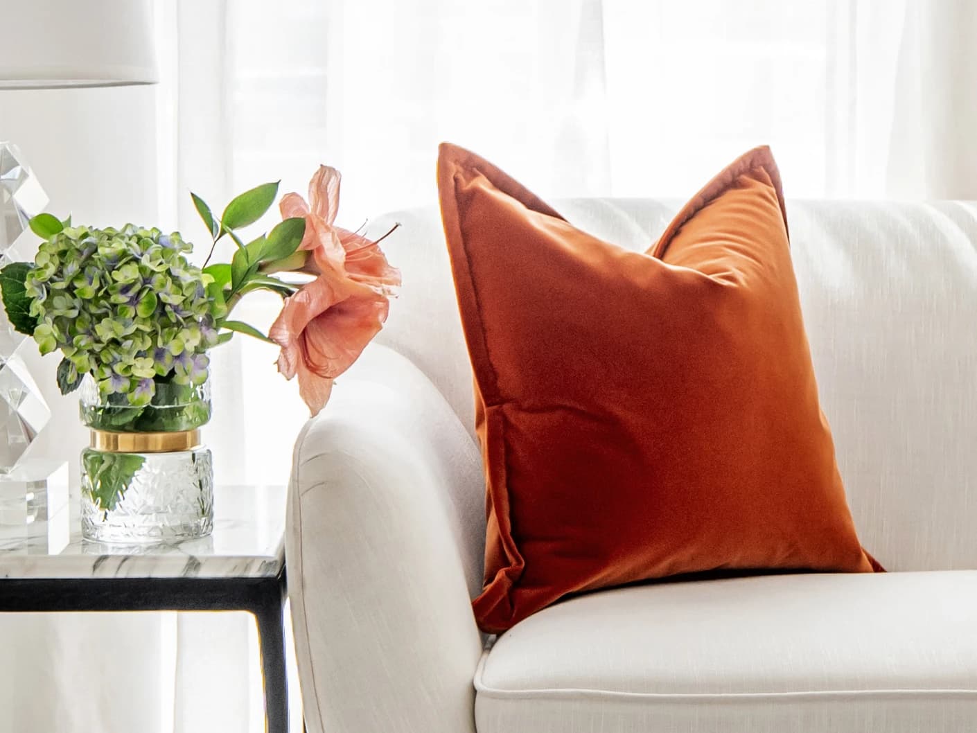 Alessandra Tangelo single cushions in tangelo and orange, shown in a lifestyle front view