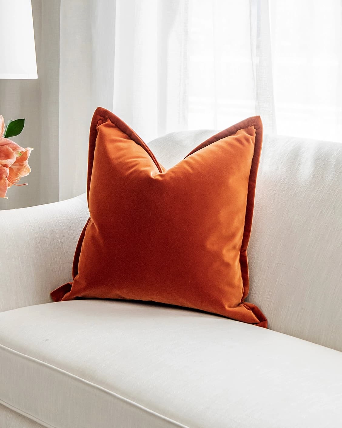 Alessandra Tangelo cushion in orange, shown in a lifestyle right view as image 2