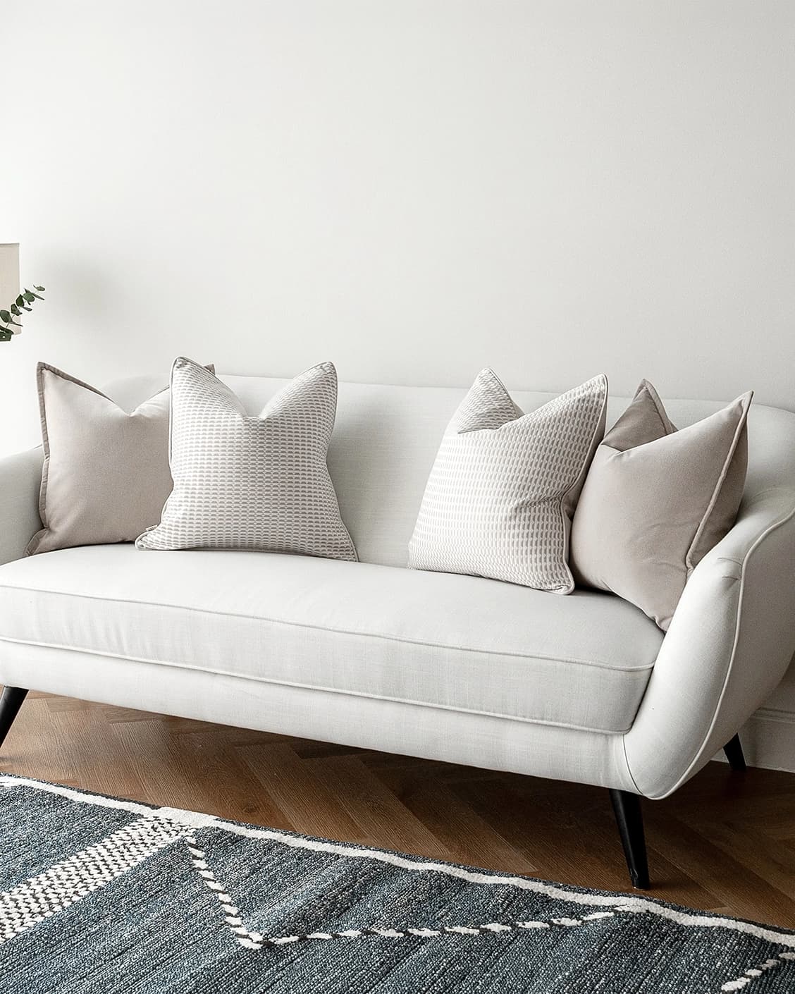Alex Bundle cushion in beige and white, shown in a lifestyle right view as image 2