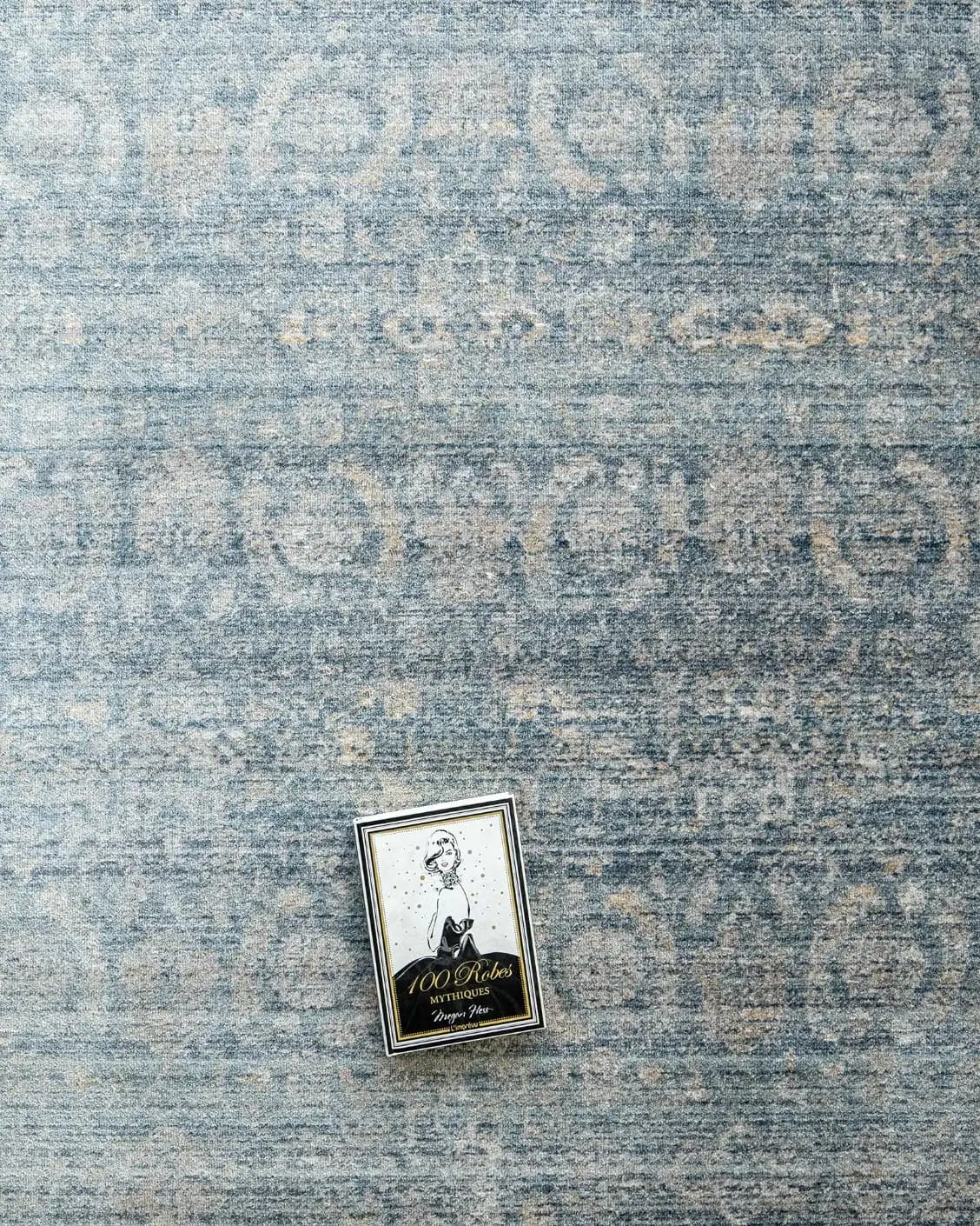 Alexander Azure carpet in blue, shown in a lifestyle top view as image 8