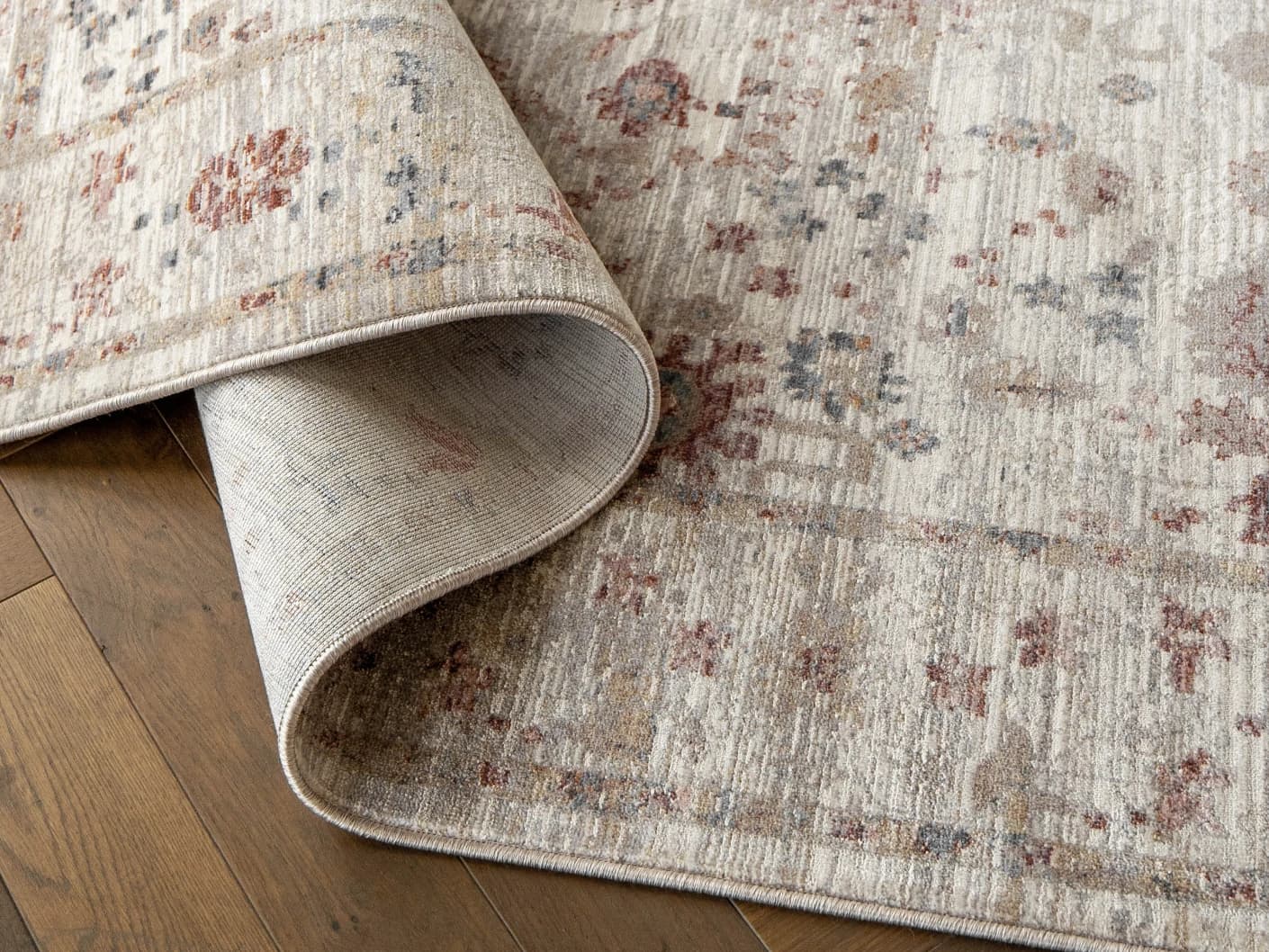 Alexander Dune carpets in dune, red and beige, shown in a product close-up top view