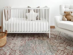 Alexander Rosso carpet in red and beige, shown in a lifestyle front view