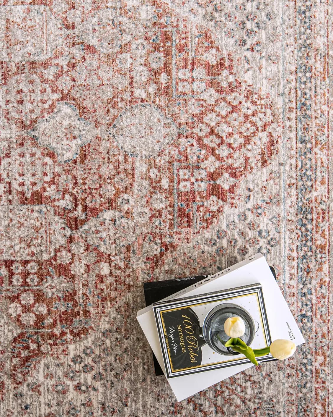 Alexander Rosso carpet in red and beige, shown in a lifestyle close-up top view as image 4
