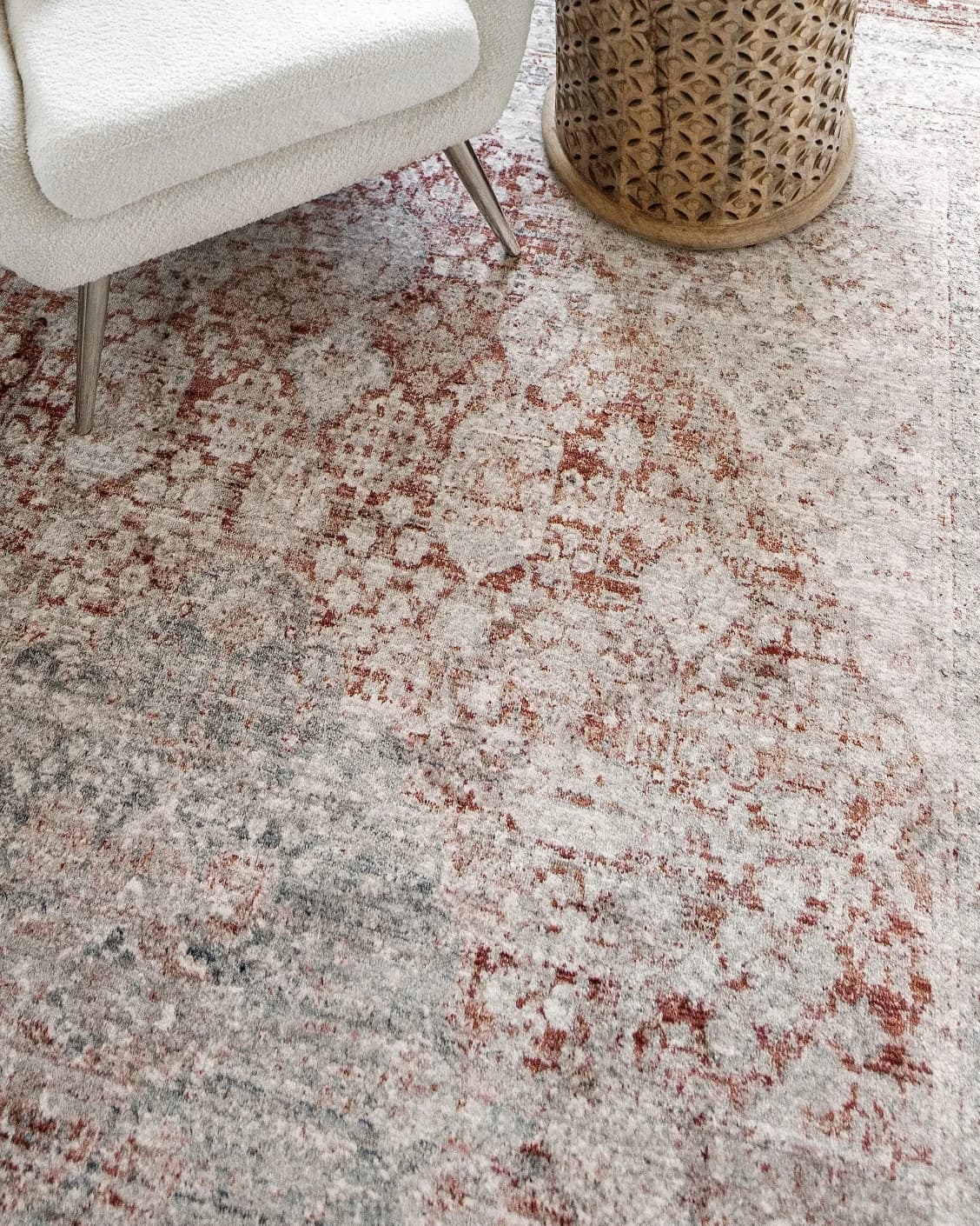 Alexander Rosso carpet in red and beige, shown in a lifestyle close-up top view as image 5