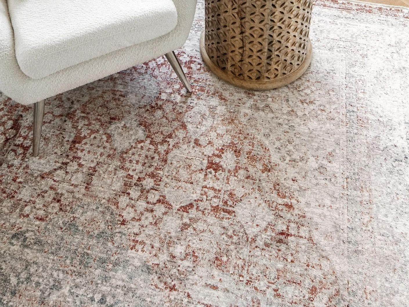 Alexander Rosso carpet in red and beige, shown in a lifestyle close-up top view as image 5