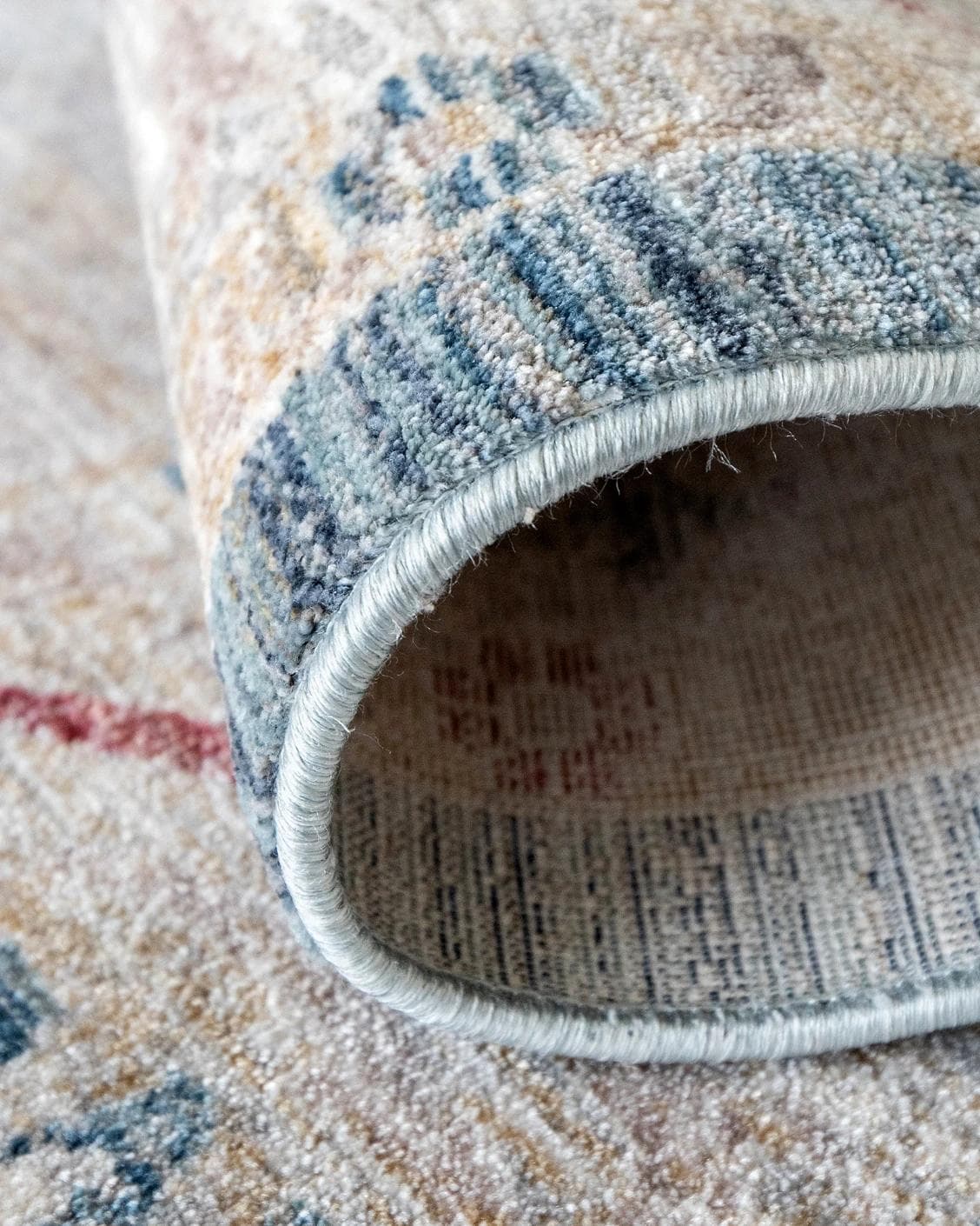 Alexander Rouge Runners carpet in beige, blue and red, shown in a product close-up as image 10