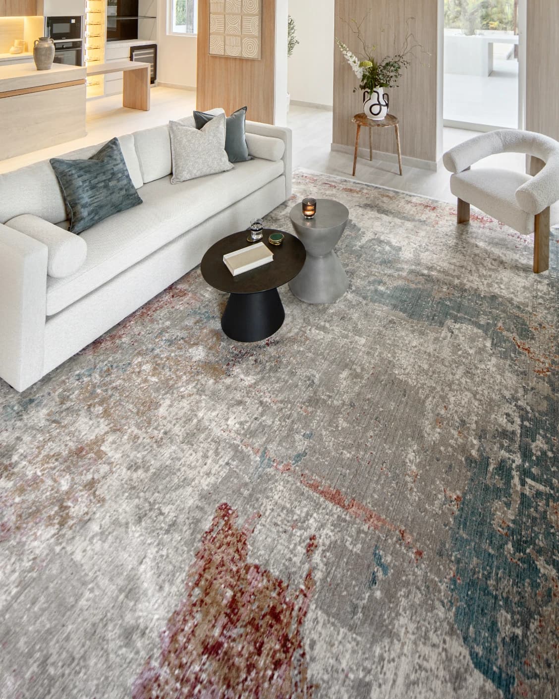 Alexander Russell carpet in beige, rust and blue, shown in a lifestyle top view as image 8