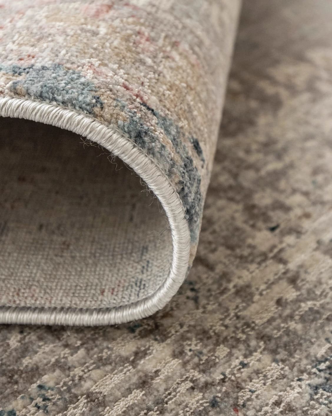 Alexander Russell carpet in beige, rust and blue, shown in a product close-up as image 10