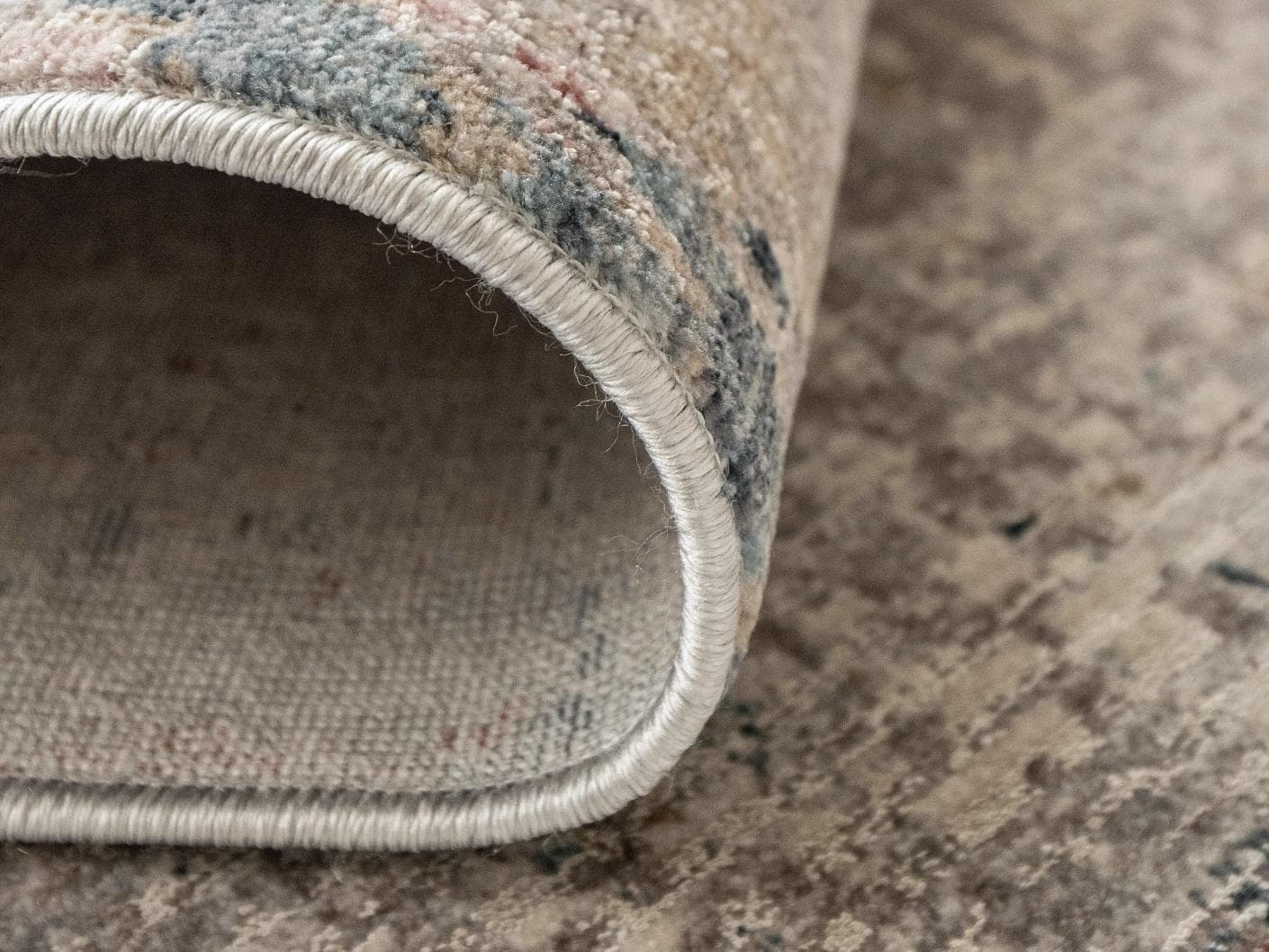 Alexander Russell carpet in beige, rust and blue, shown in a product close-up as image 10