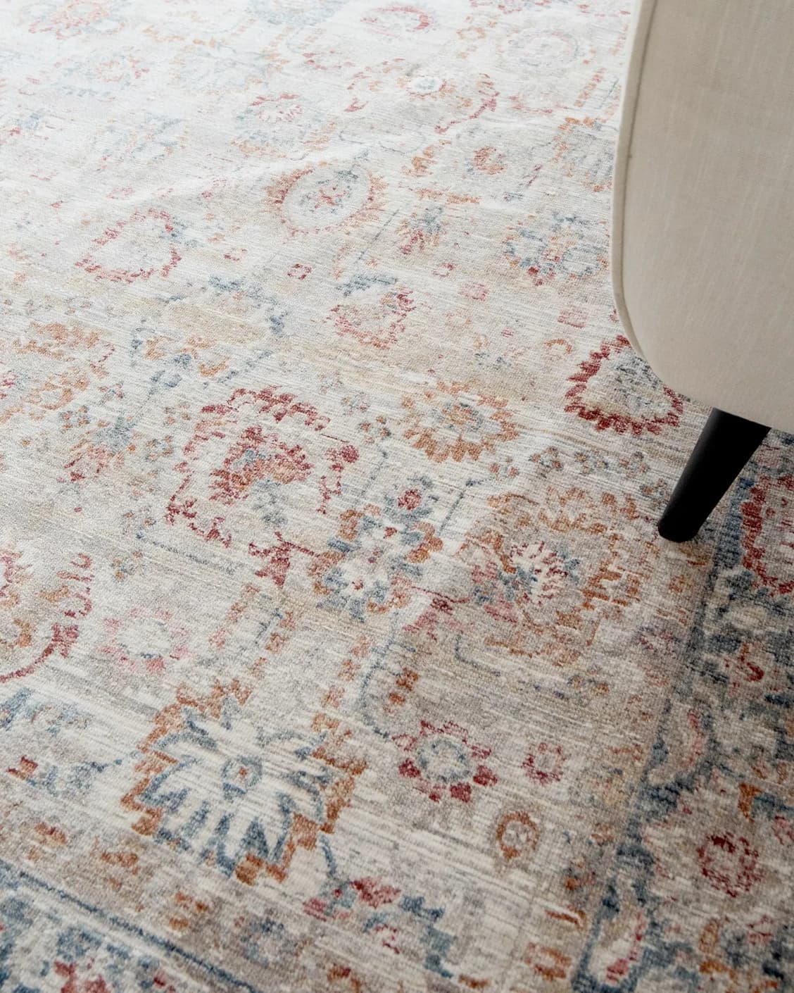 Alexander Sandy carpet in beige and red, shown in a lifestyle close-up as image 4