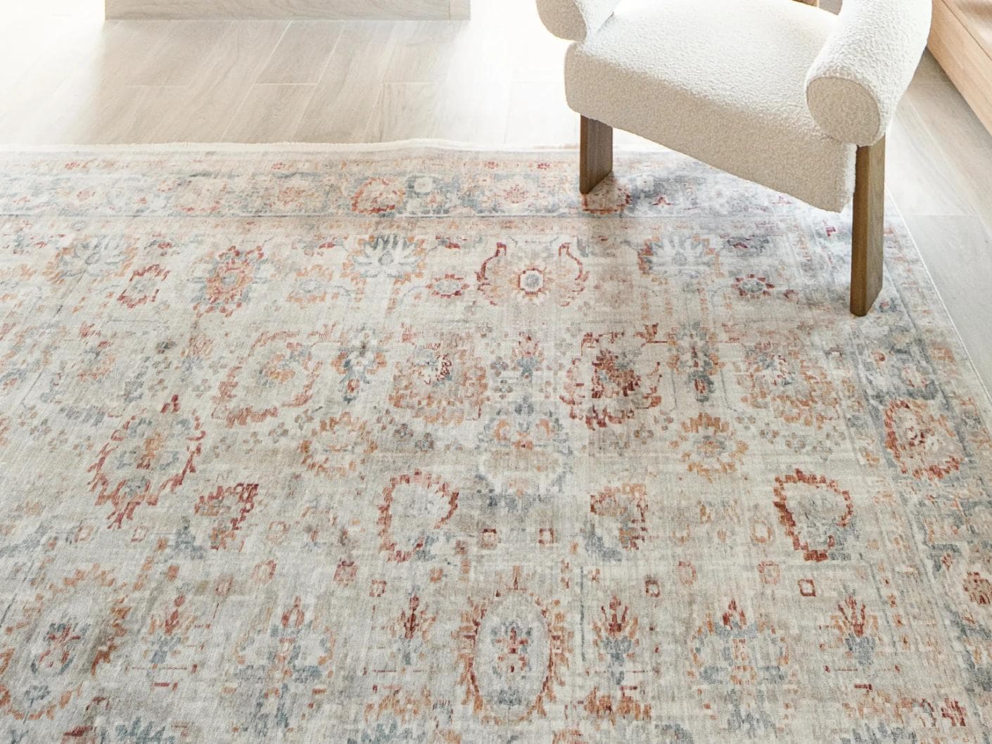 Alexander Sandy carpet in beige and red, shown in a lifestyle close-up top view as image 5