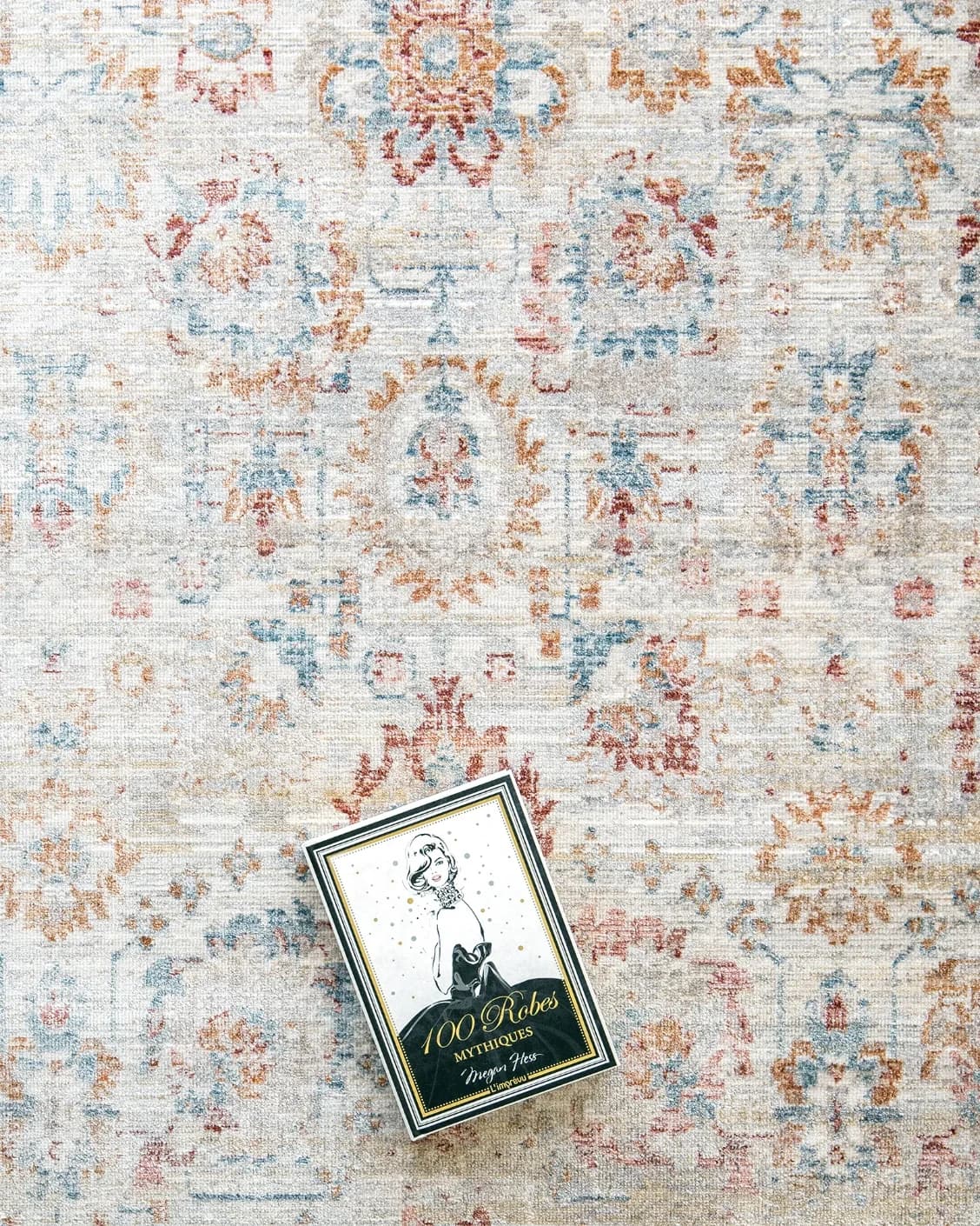 Alexander Sandy carpet in beige and red, shown in a lifestyle top view as image 11