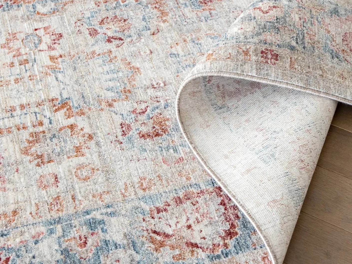 Alexander Sandy carpets in sandy, beige and red, shown in a product top view