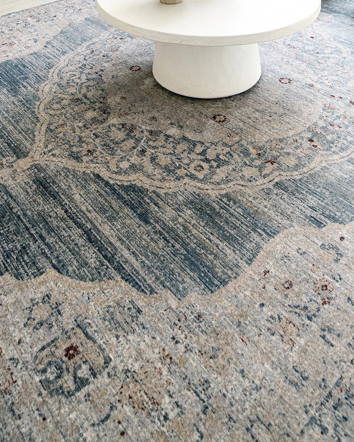 Alexander Sky carpet in pale blue, blue and beige, shown in a lifestyle close-up as image 4