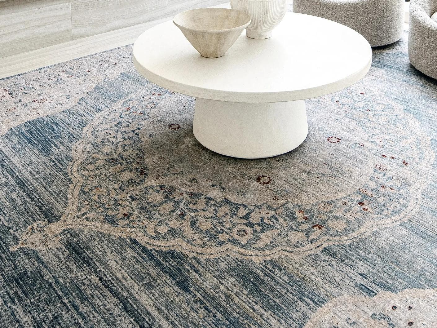 Alexander Sky carpet in pale blue, blue and beige, shown in a lifestyle close-up as image 4