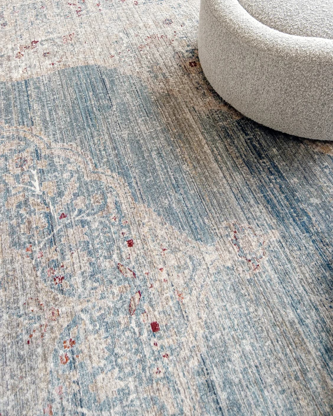 Alexander Sky carpet in pale blue, blue and beige, shown in a lifestyle close-up as image 5