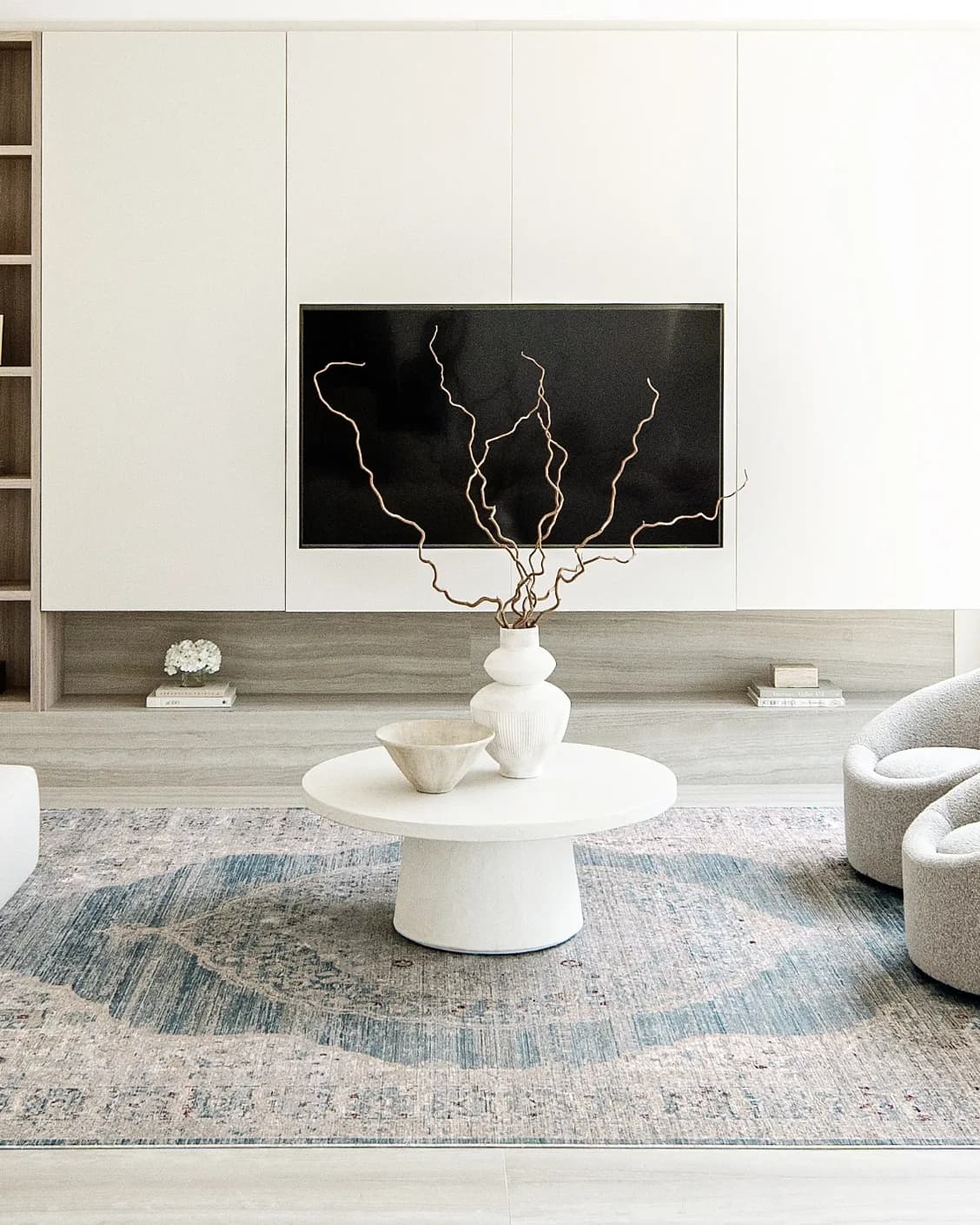 Alexander Sky carpet in pale blue, blue and beige, shown in a lifestyle front view as image 6